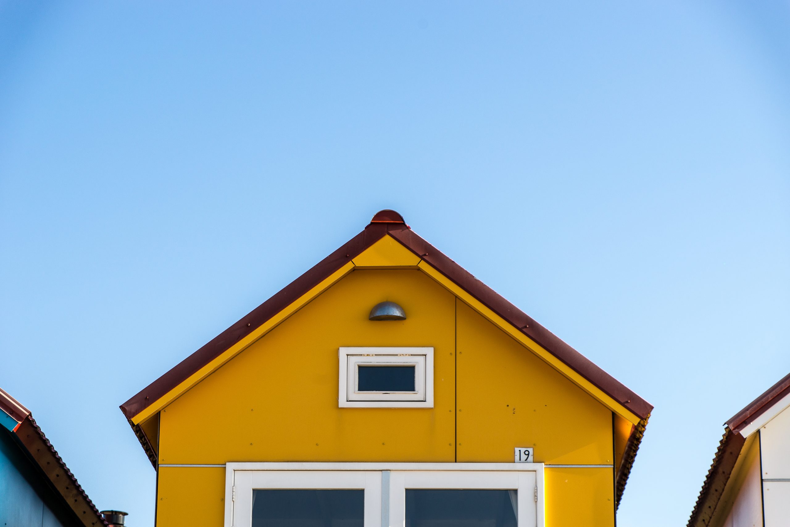 Yellow facade of a small house at the Camping De Nolle Vlissingen in the Netherlands